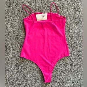 Pink body suit